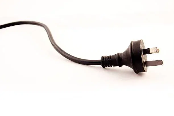 A Free pat test Tooting displays a minimalist design, featuring a sleek black cable with a contrasting black plug. The attention to detail elevates its modern aesthetic, making it a standout choice.