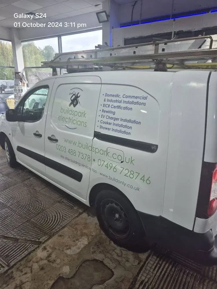 BuildSpark electrician van in Tooting displaying services