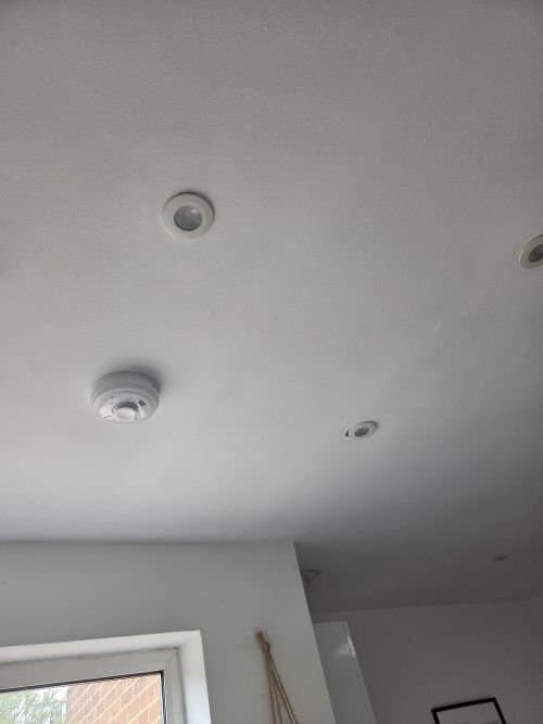 Aico interlinked smoke alarm installed on a ceiling in a residential property by BuildSpark Electrician, providing fire detection and landlord compliance across London.