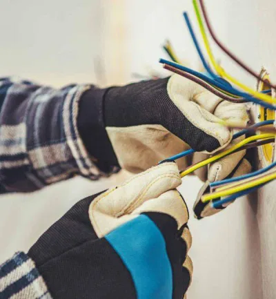 Qualified electrician Wimbledon carrying out electrical installation work in a home