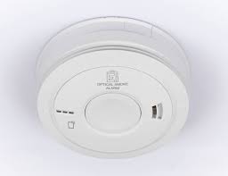 White Aico smoke alarm mounted on ceiling in London rental property installed by landlord electrician for EICR and electrical safety compliance