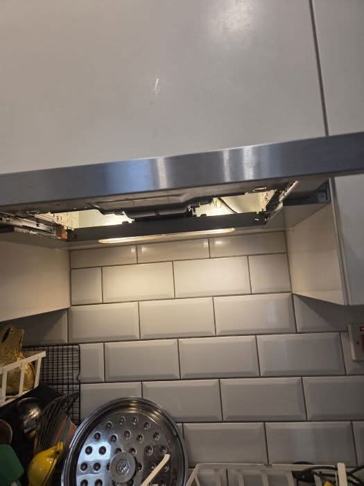 Cooker hood lighting and extractor fan repaired by a BuildSpark electrician at a property in Putney.