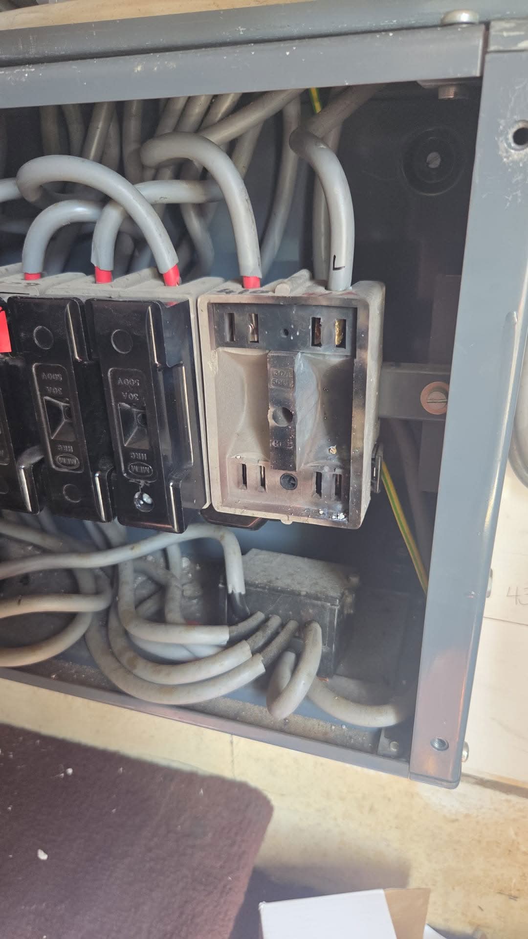 Burnt Fuse Carrier Repaired in Earlsfield | Emergency Electrician Burnt fuse carrier discovered during electrical fault finding in Earlsfield after overheating caused damage to the protective device.